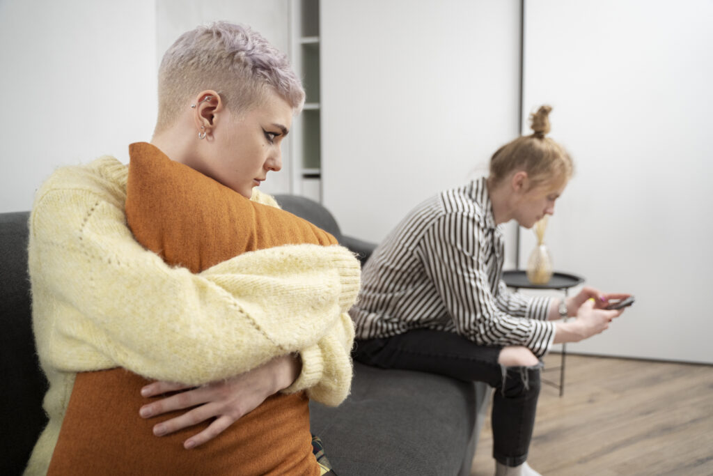 sad woman hugging pillow